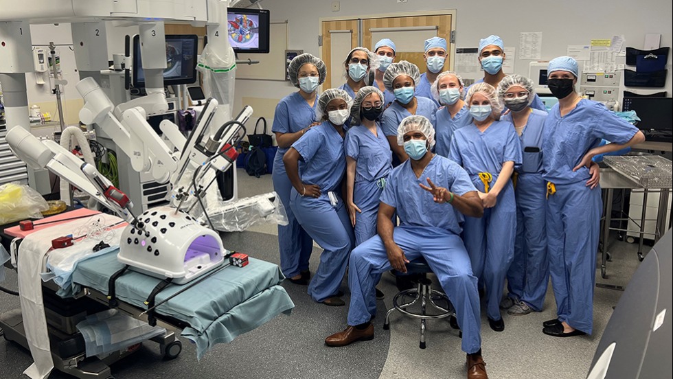 doctors in hospital scrubs posing for a photo