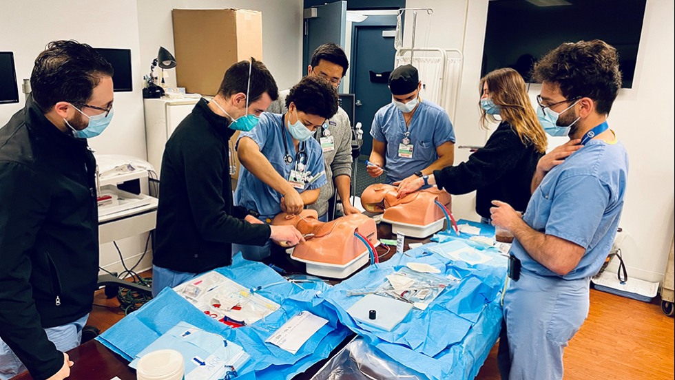 doctors performing surgical tasks on dummies