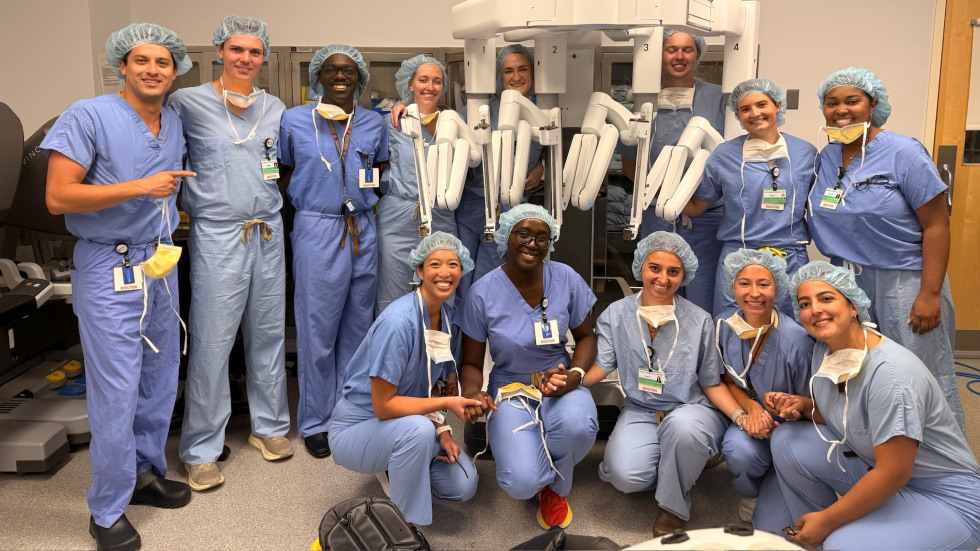 doctors in hospital scrubs posing for a photo