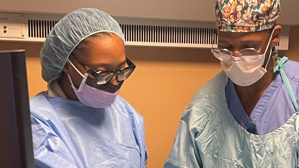 two doctors in scrubs with ultrasound