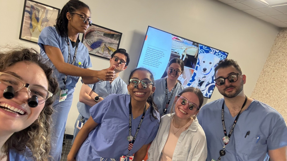 group of doctors posing with loupes